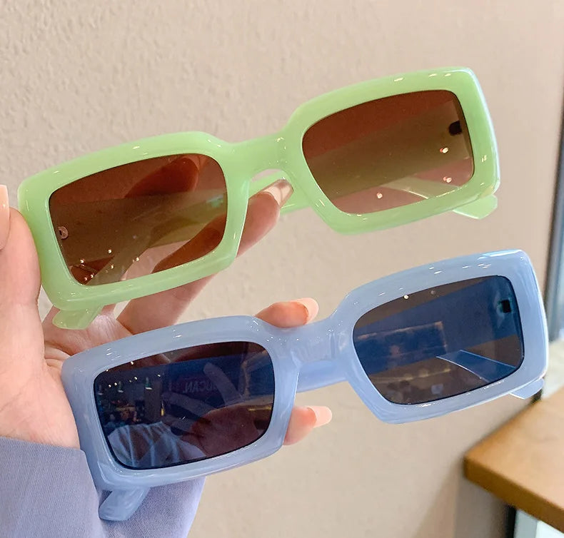 MCROONS Candy Colour sunglasses - green and blue variants, held