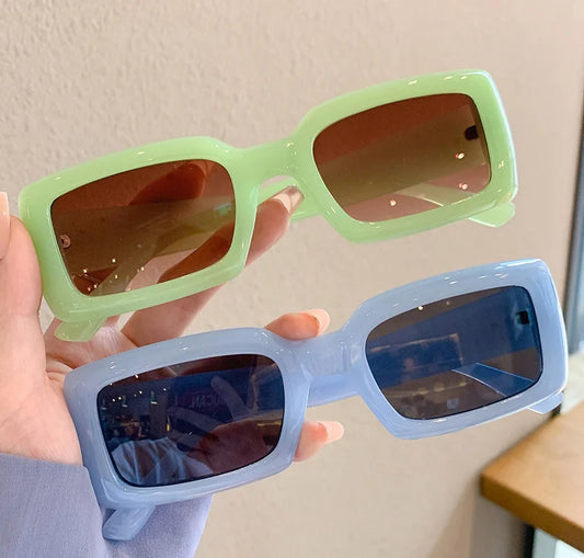 MCROONS Candy Colour sunglasses - green and blue variants, held